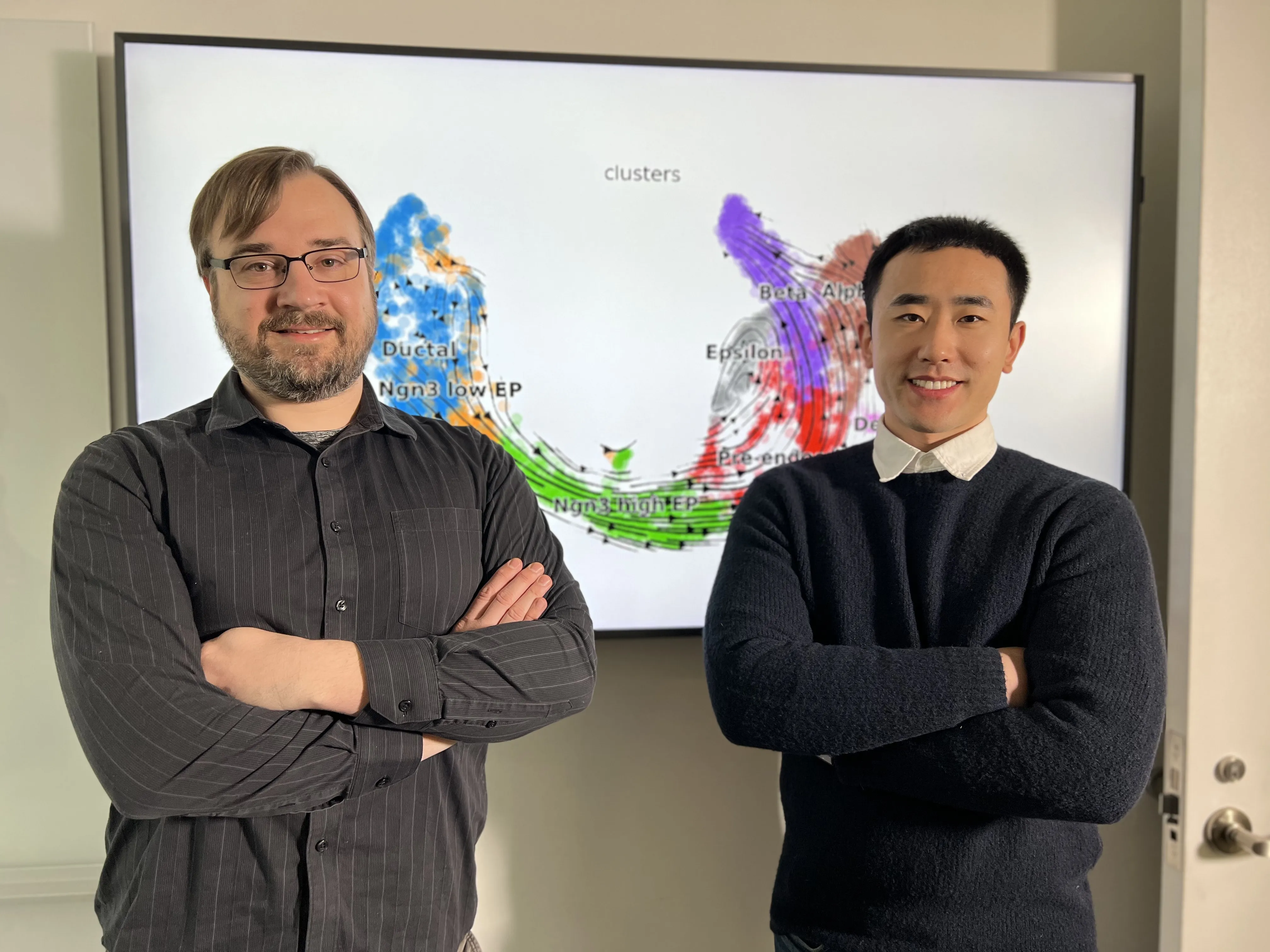 researchers standing in front of genomic data
